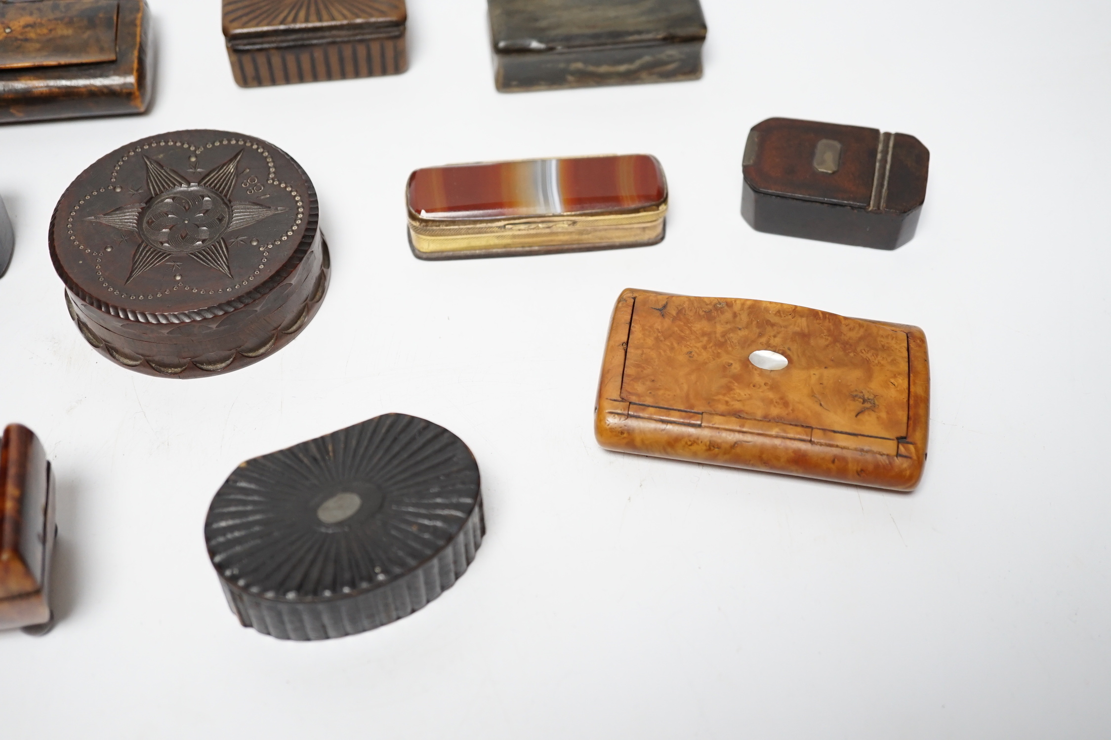 A collection of ten snuff boxes in tortoiseshell, treen or horn, etc.